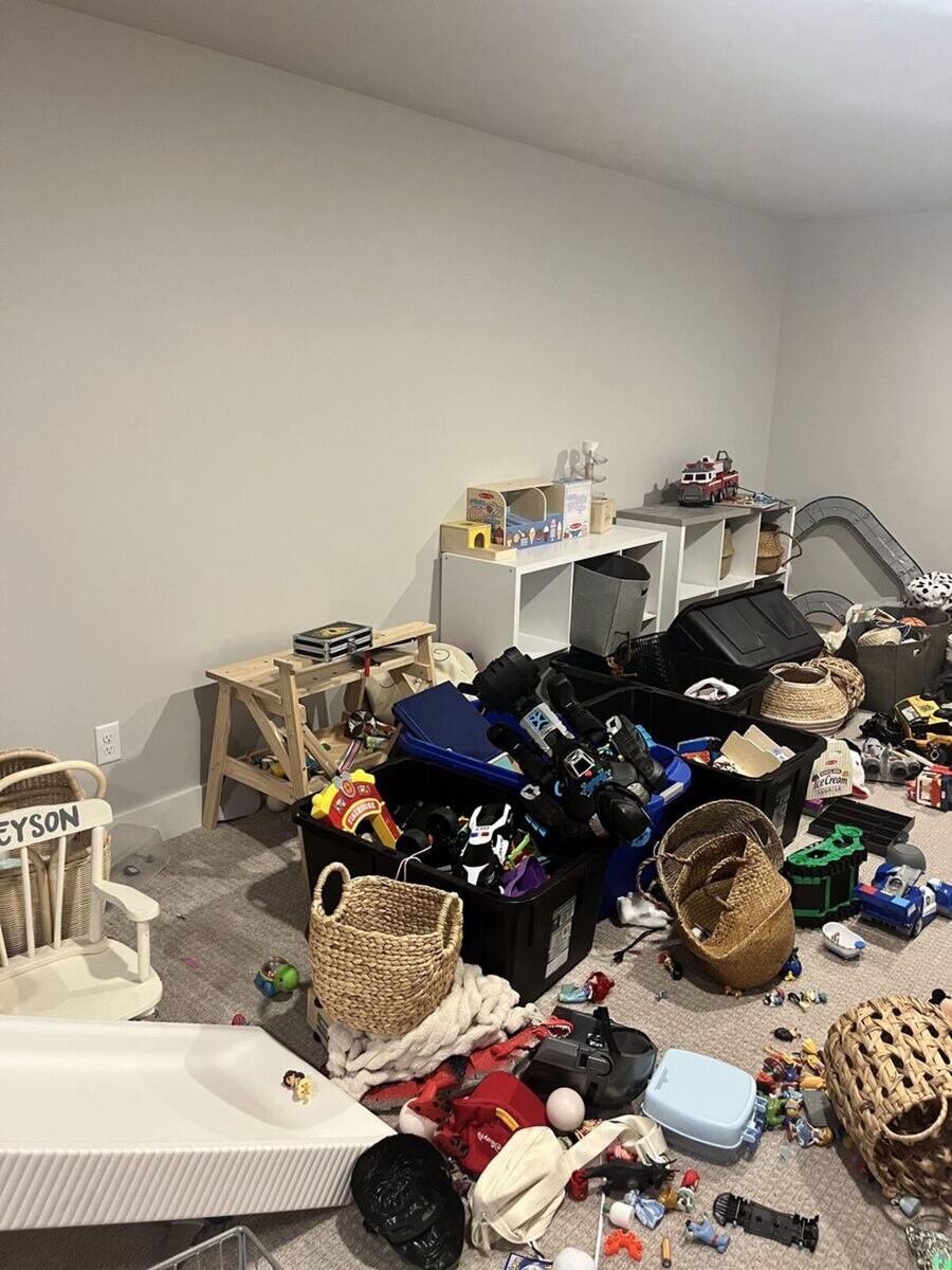 Playroom before organizing with toys everywhere