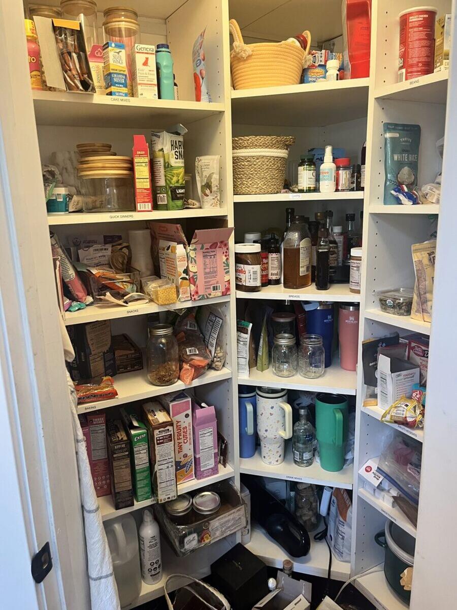 Pantry before organizing with cluttered shelves